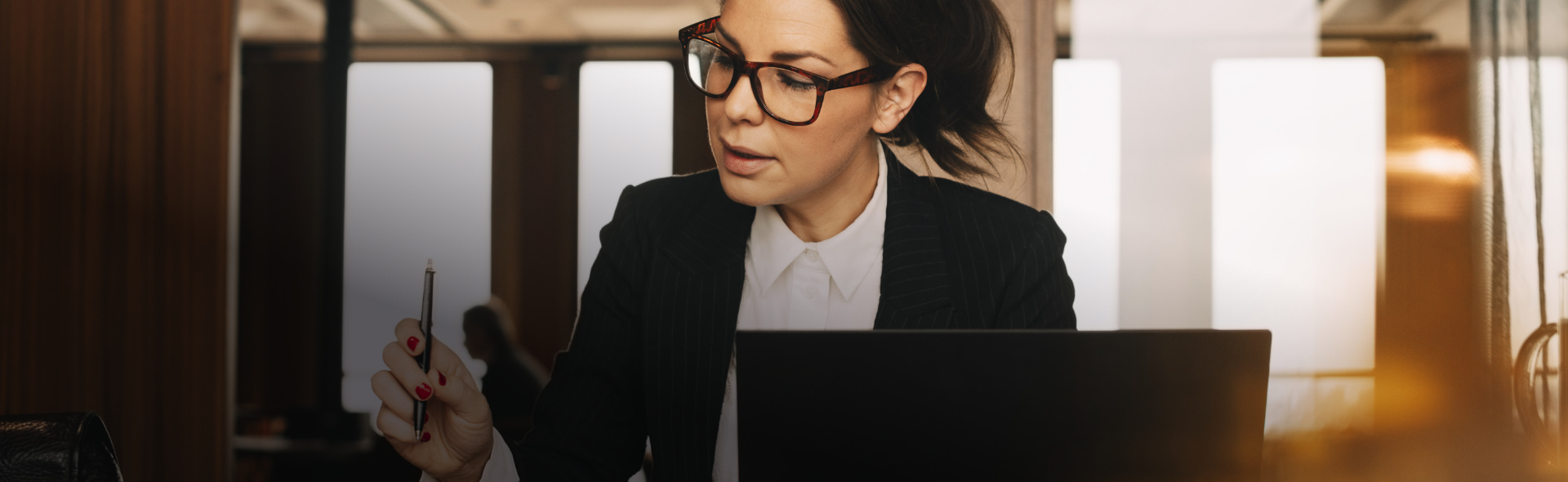 lawyer working on laptop after receiving a Online Juris Doctor Degree from the JFK School of Law