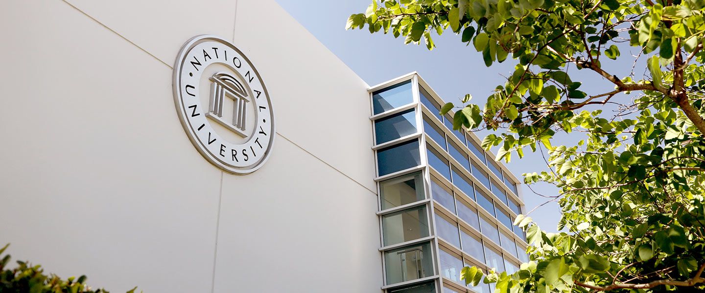 National University logo on the side of a building