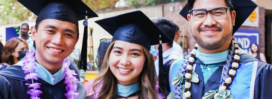 3 people at 2021 commencement 