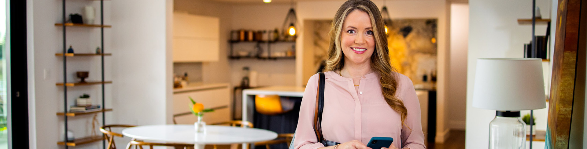 Woman in kitchen ready to leave for the day