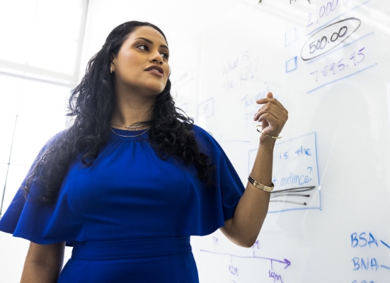 woman at a white board 