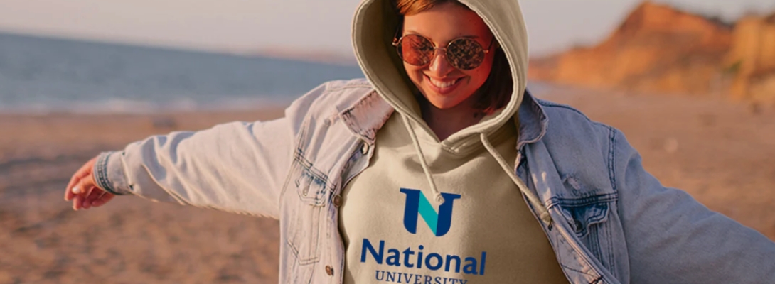 female waring a white new national university  hooded sweatshirt