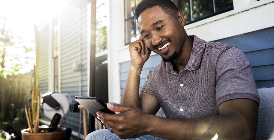 man looking at a cell phone