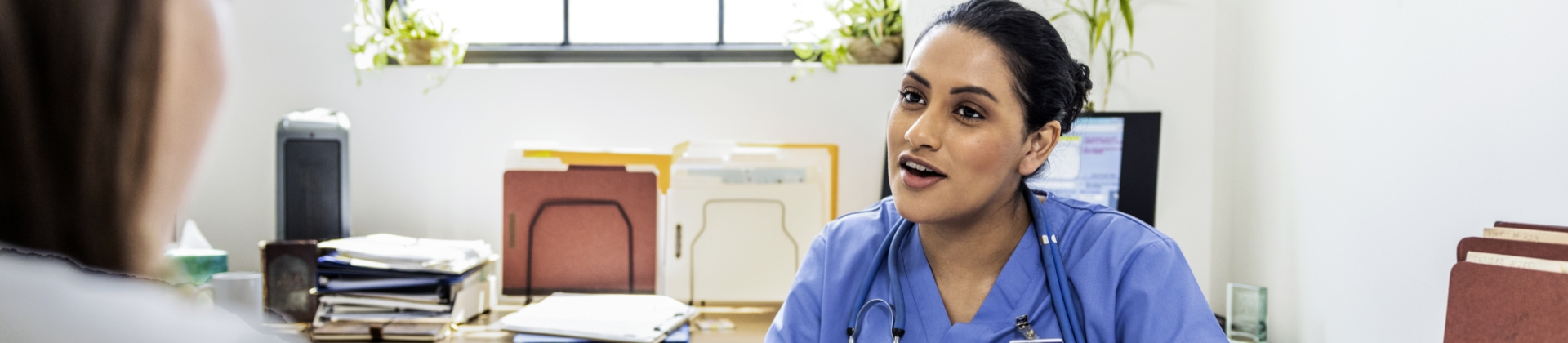 doctor consulting with a patient in office