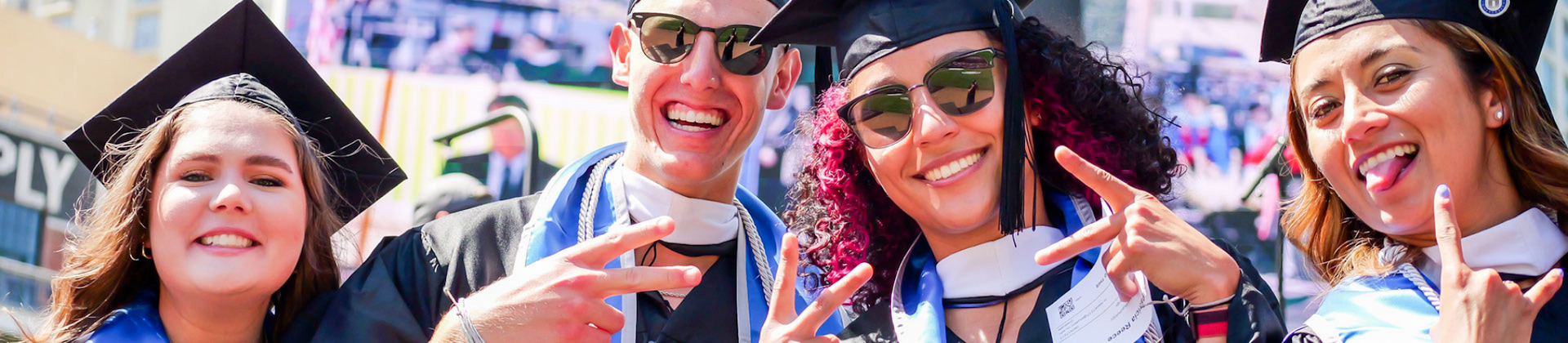 NU graduates pose for the camera