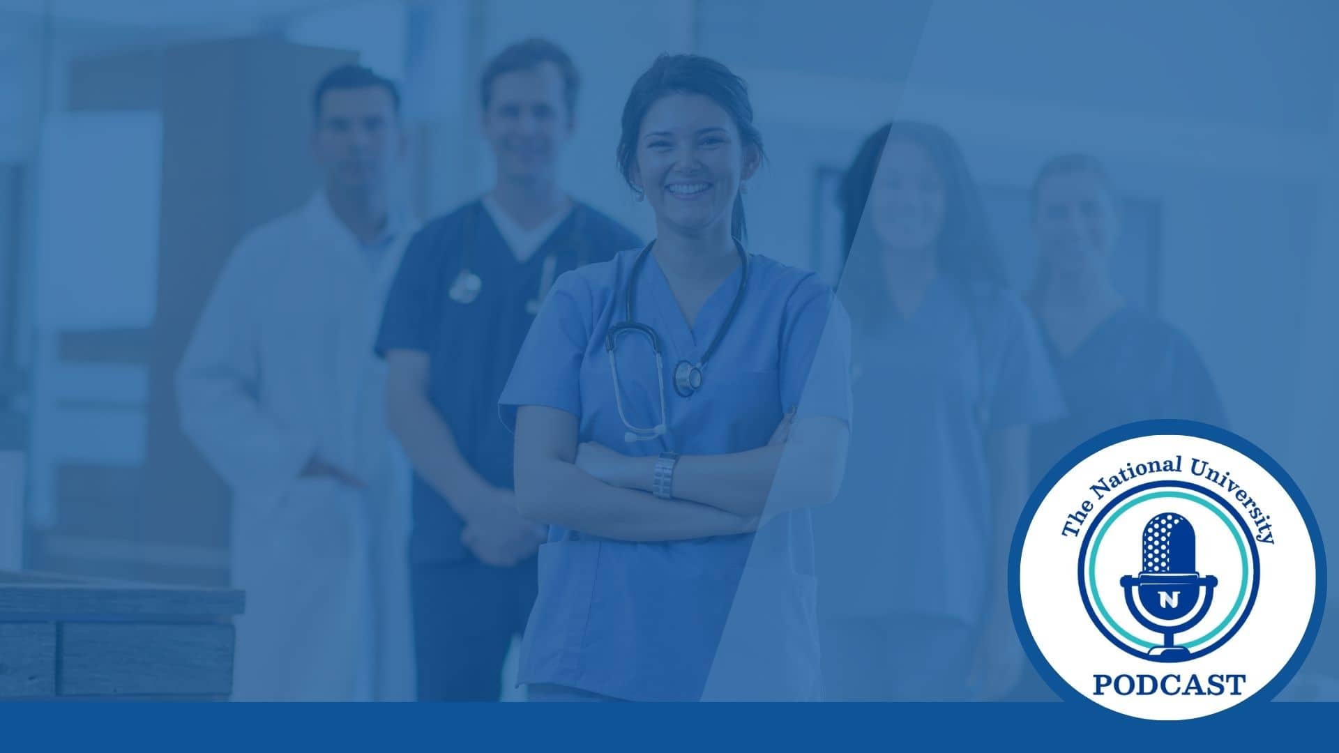 several male and female health care workers stand facing the camera