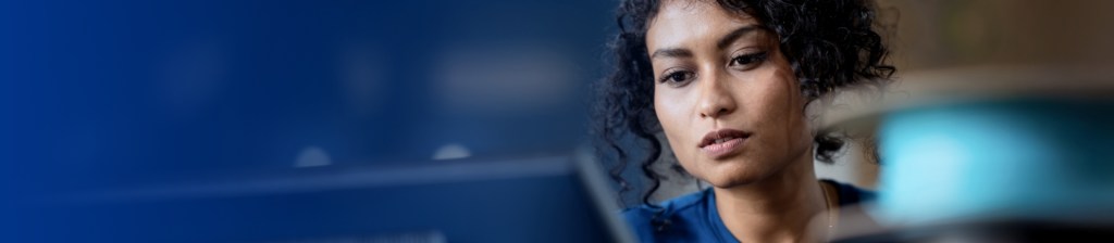 woman doing research on laptop