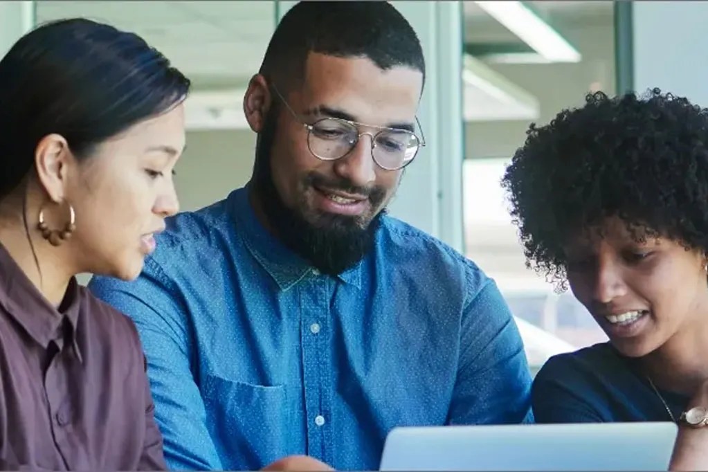 group looking at computer together